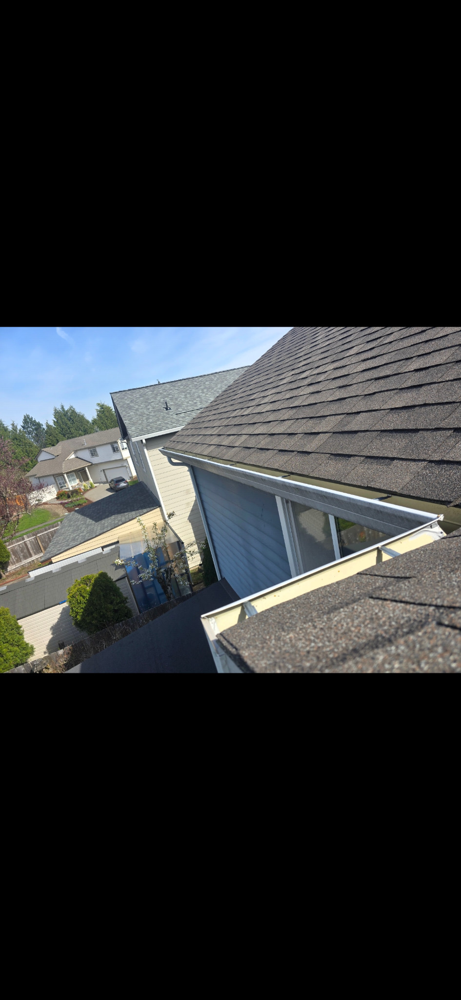 Long white gutter face with gray and dark staining.